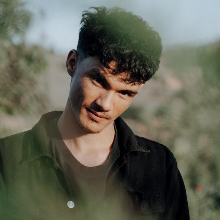 Kaveri Mehta, Lead Design Curator at Gold Studio Portal, reviewing corporate floral arrangements